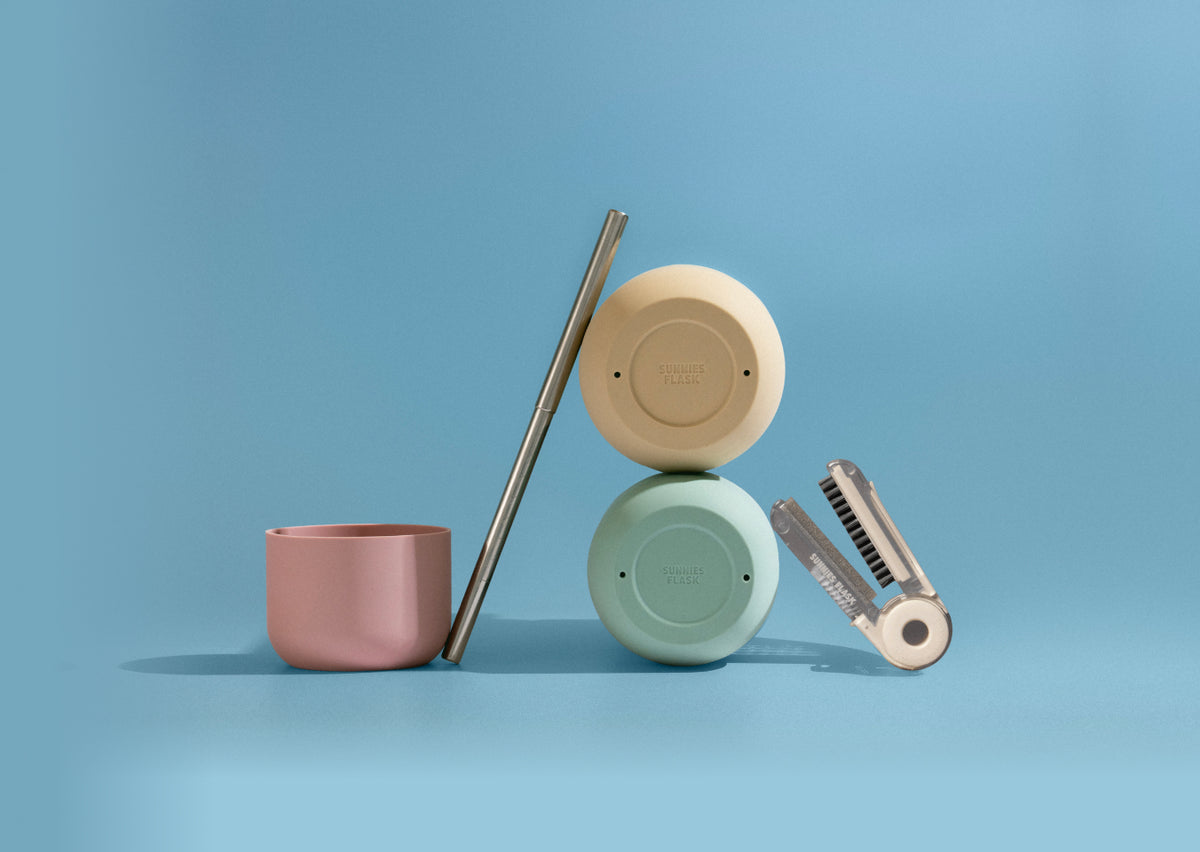 Discover the Sunnies Studios Summer Collection — colorful insulated water bottles with straps, caps, and accessories designed for outdoor days and everyday hydration.