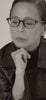 Dolly wearing Eyeglasses with Lens Grades for Men and Women.